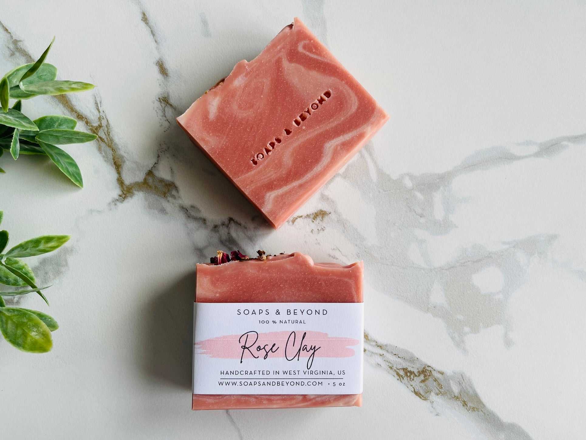 Natural handcrafted rose clay soap bar with shea butter and essential oils on marble surface