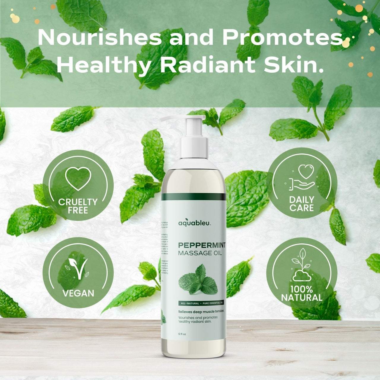 Bottle of aquableu peppermint massage oil surrounded by fresh peppermint leaves with text highlighting cruelty-free, vegan, daily care, and 100% natural benefits
