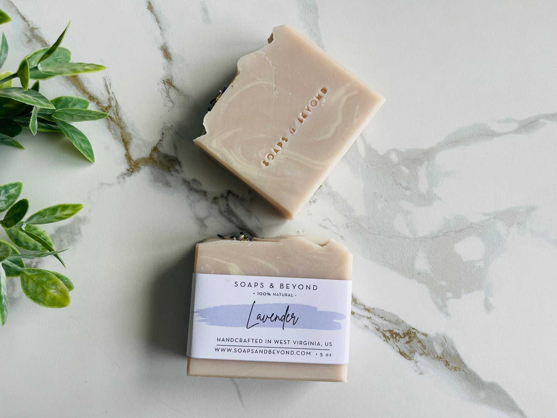 Natural handmade lavender soap bar with shea butter and kaolin clay on marble surface