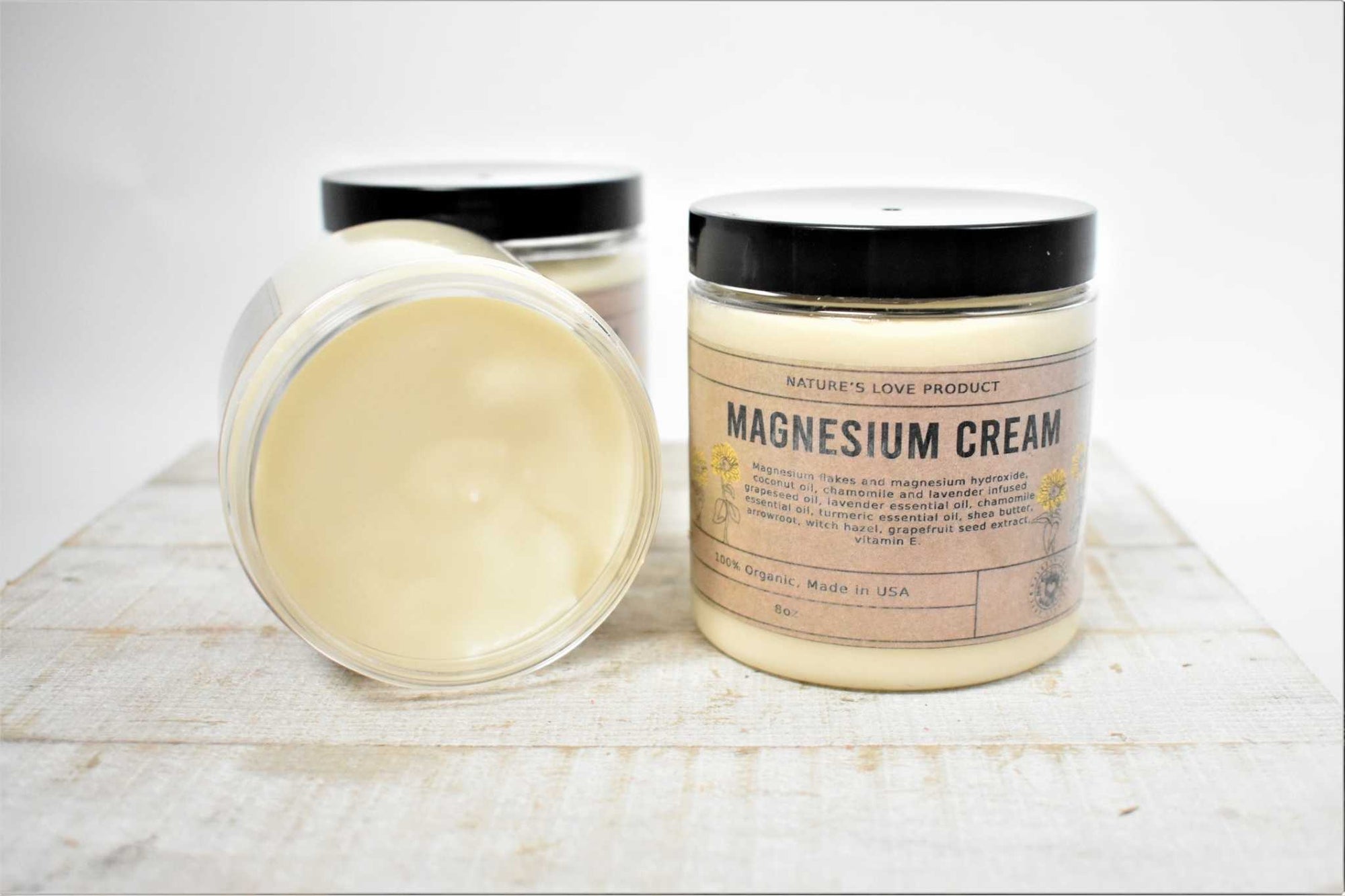 8oz jar of magnesium cream with a thick, silky texture and natural ingredients for skin nourishment and muscle relief