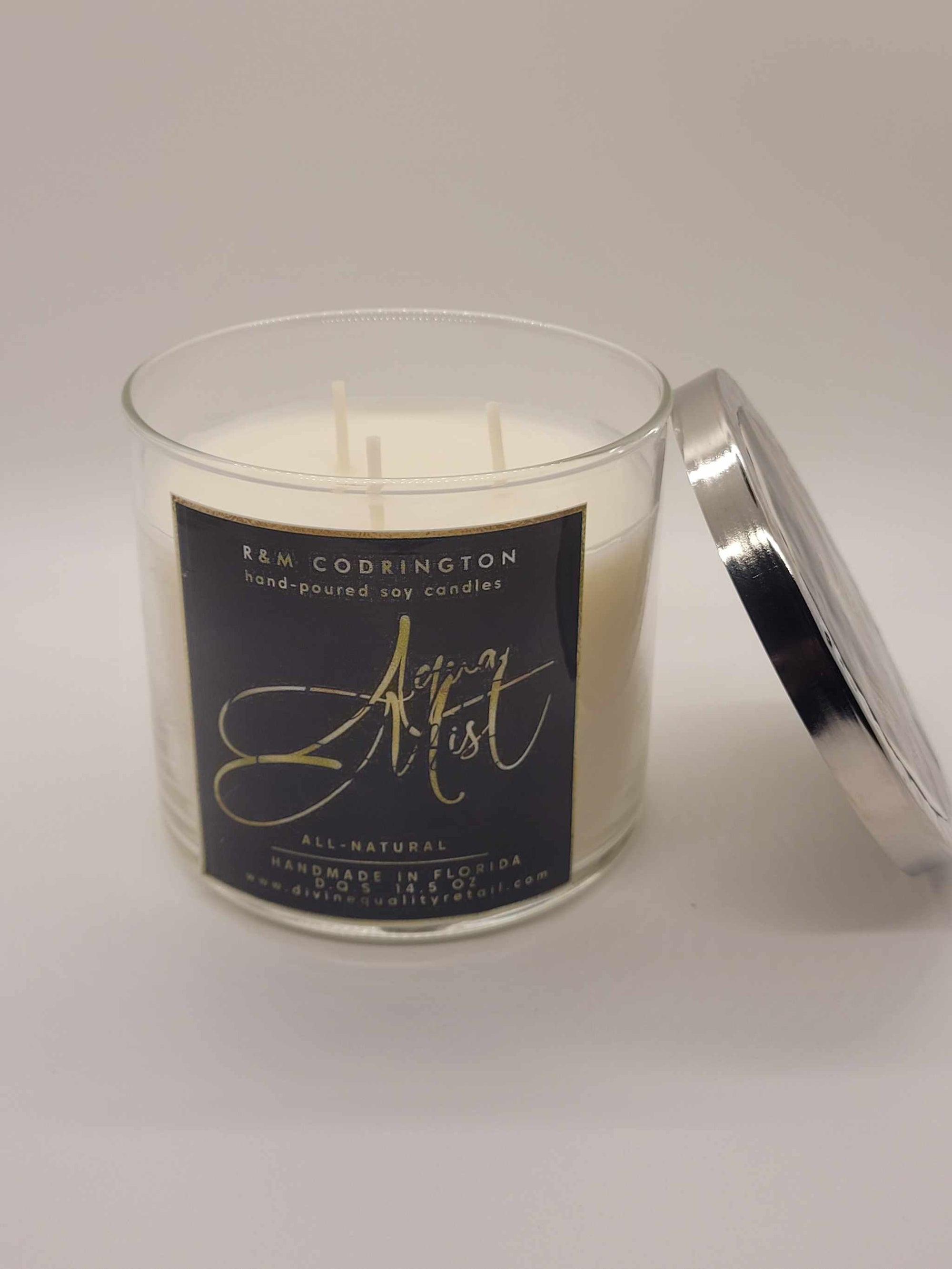 Aqua Mist Scented Candle with three wicks in clear glass jar and silver lid, white soy wax, calming fragrance for aromatherapy and stress relief
