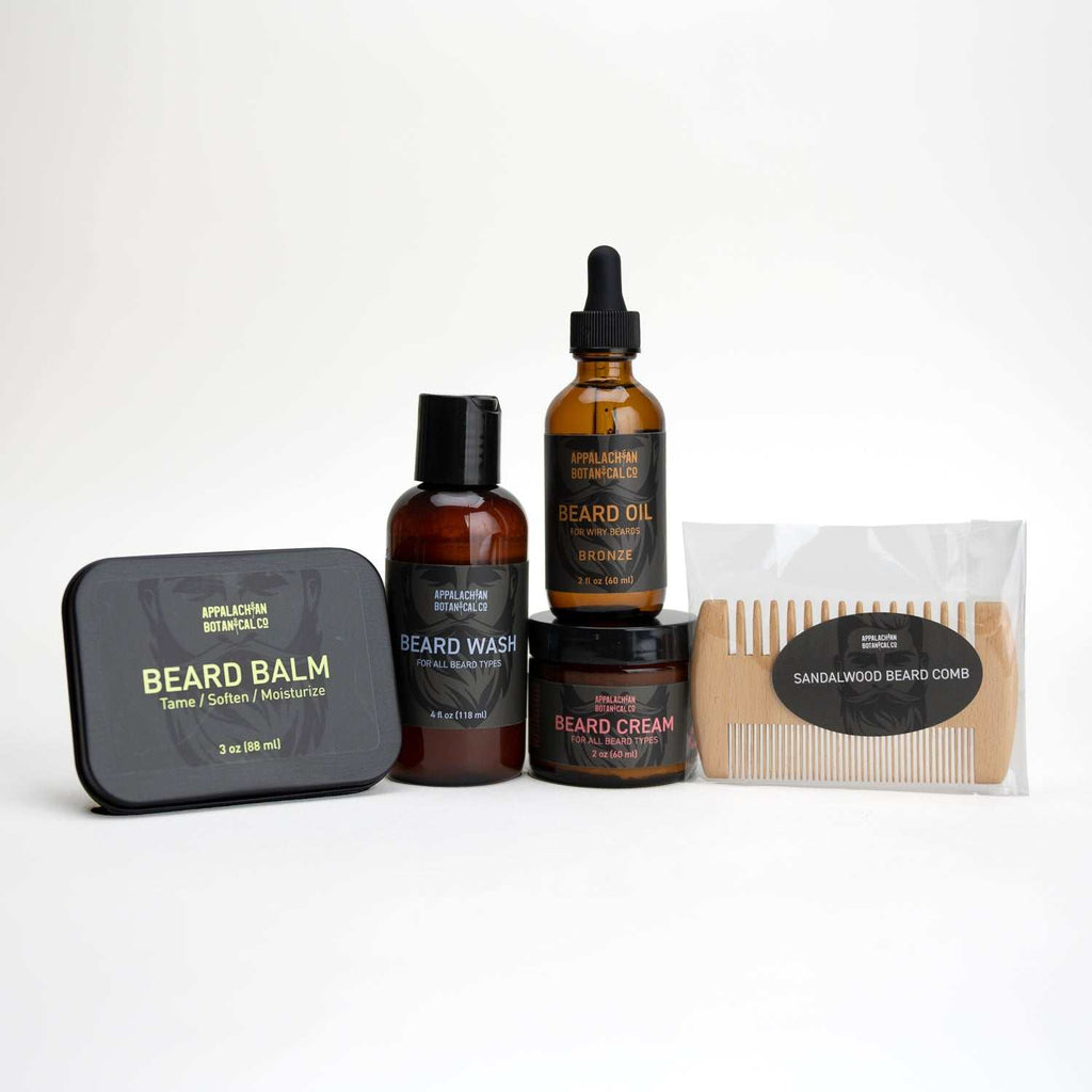 Complete Beard Care Bronze Kit with beard balm, wash, cream, oil, and sandalwood comb for beard grooming and moisturizing