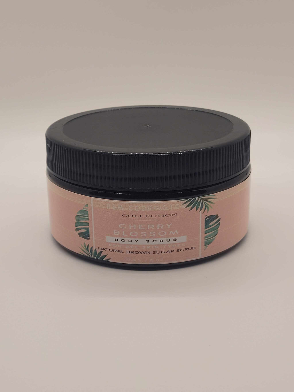 Cherry Blossom Exfoliating brown sugar scrub in an amber jar with black lid
