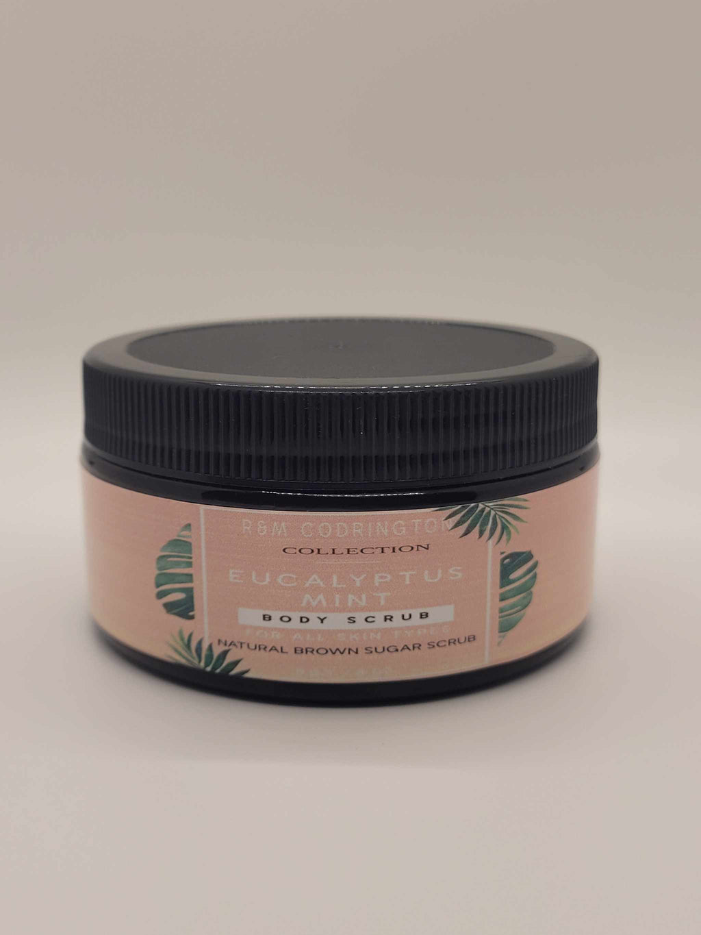 Eucalyptus Mint Brown Sugar Scrub in amber jar with black lid for natural exfoliation