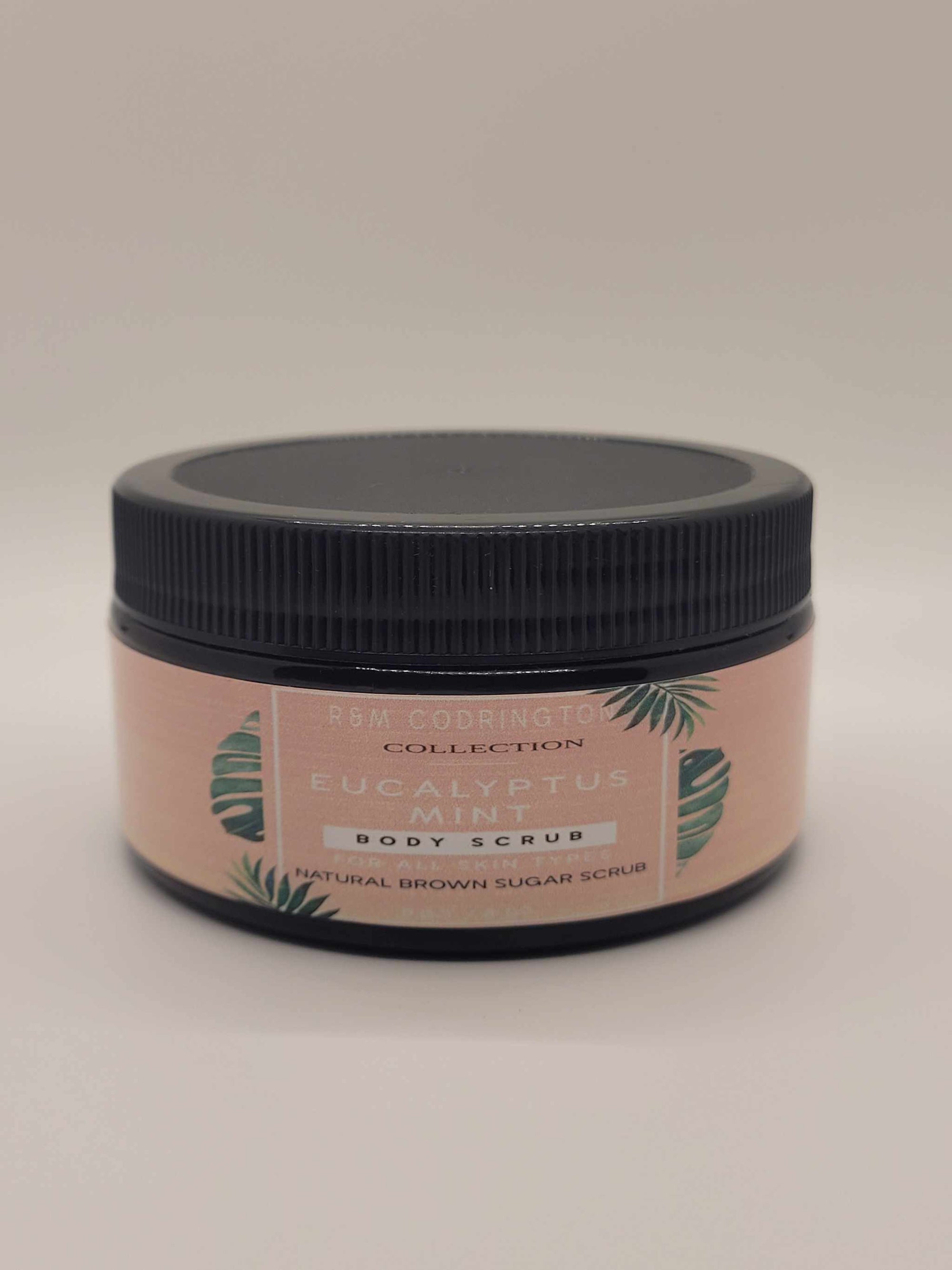 Eucalyptus Mint Brown Sugar Scrub in amber jar with black lid for natural exfoliation