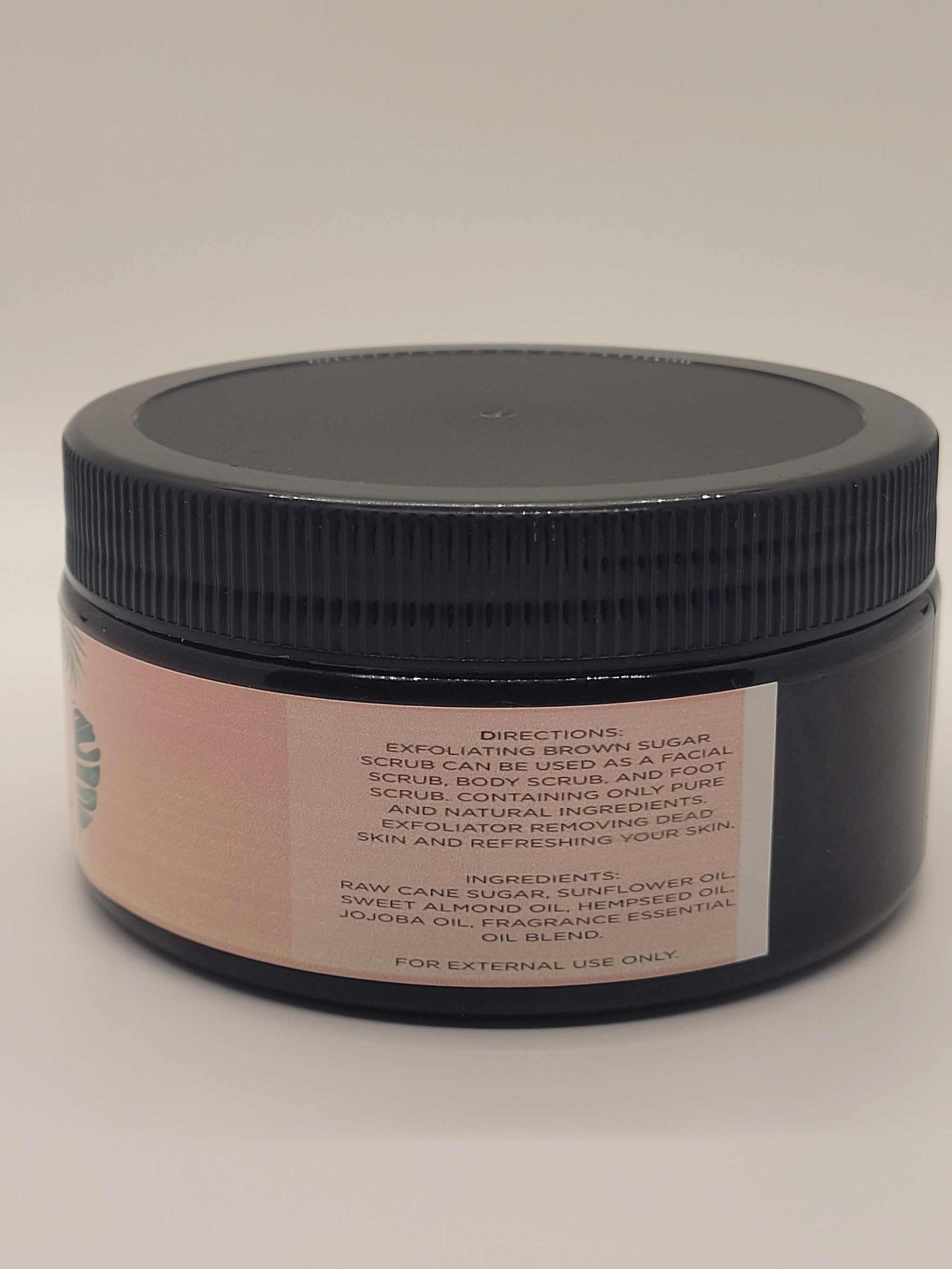 Cherry Blossom Exfoliating brown sugar scrub in an amber jar with black lid